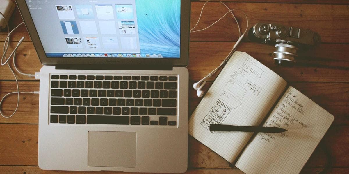 Desk with a laptop and notebook